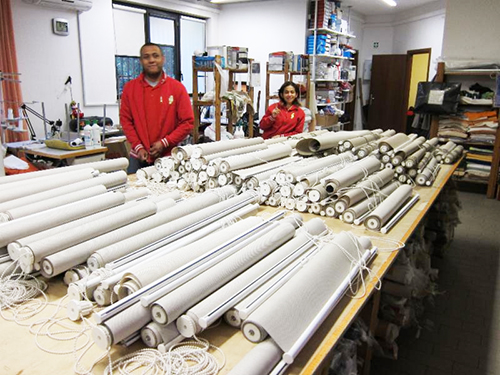 The Lavare Tutto staff prepping roller binds for cleaning.