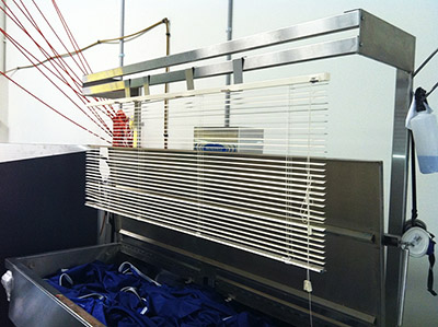 Kleena’s SM-200-XL machine cleaning slings and blinds.